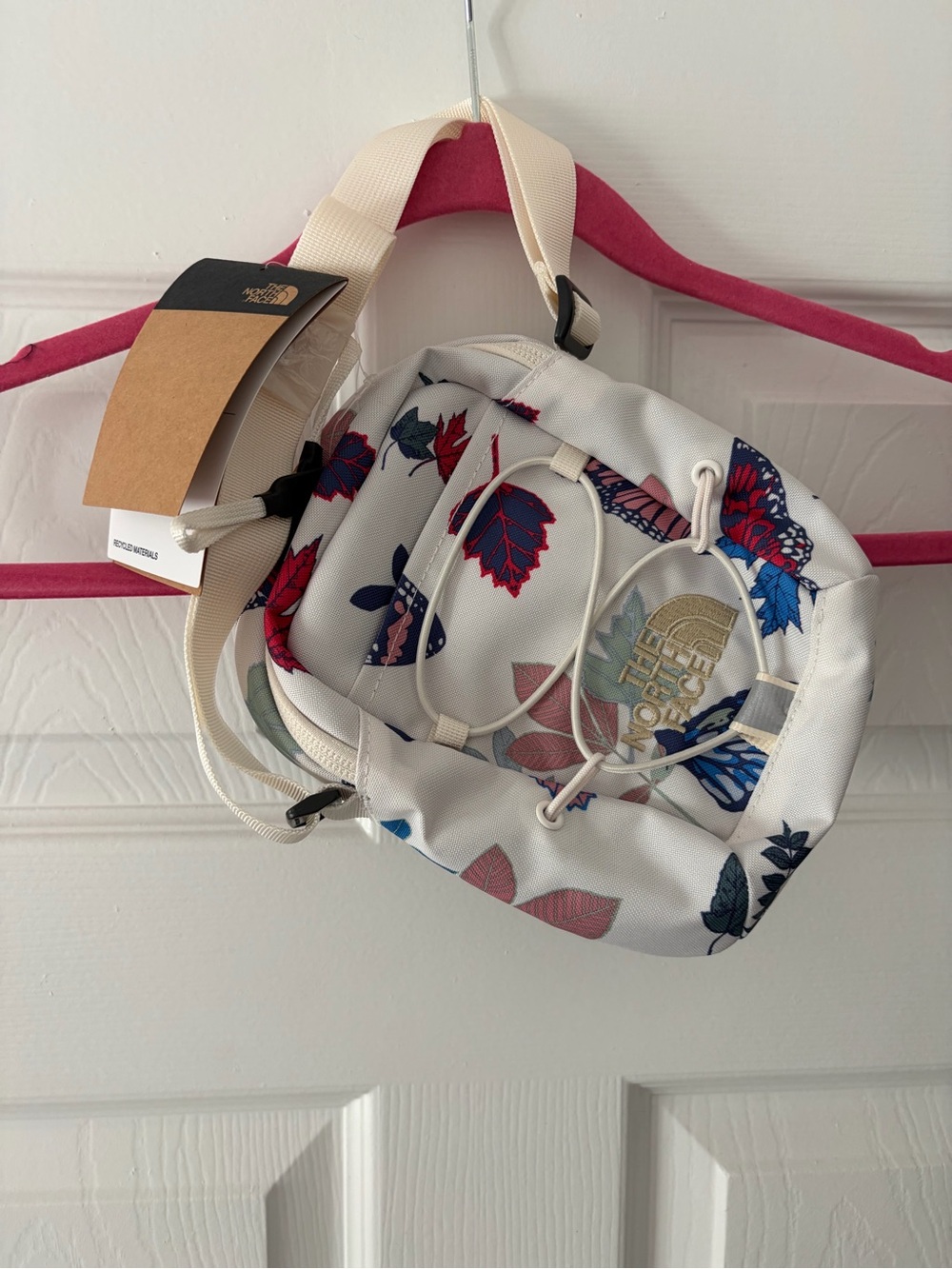 The North Face White Floral Print Crossbody Bag with Cream Strap